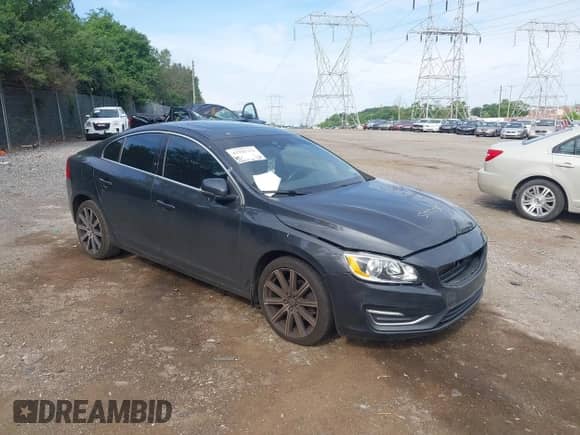 2015 Volvo S60 T5 Drive-E Premier with VIN YV126MFB9F1299878, listed as a IAAI auction lot 42781752 with 128,657 mi miles and . Bid and sale history available at DreamBid. Image 1.