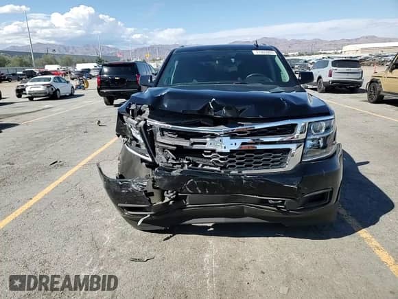 2020 Chevrolet Tahoe LS z VIN 1GNSCAKC1LR189763, wystawiony jako Copart lot #71305905 z przebiegiem 68 205 mil mil oraz Szkoda całkowita • Salvage title. Historia ofert i sprzedaży dostępna na DreamBid. Obrazek 14.