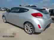 2012 Hyundai Veloster w/Gray Int z VIN KMHTC6AD8CU022989, wystawiony jako IAAI lot #42523328 z przebiegiem 169 005 mil mil oraz . Historia ofert i sprzedaży dostępna na DreamBid. Obrazek 3.