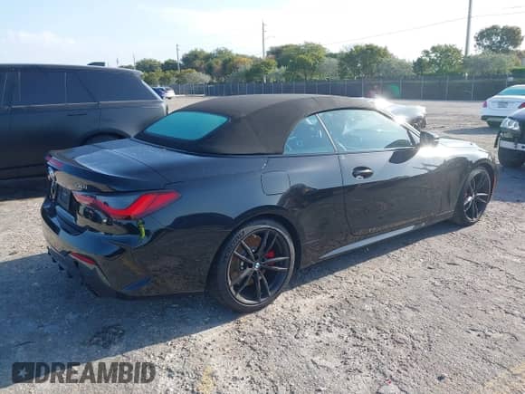 2022 BMW 4 Series 430i with VIN WBA23AT06NCJ10779, listed as a IAAI auction lot 42000961 with 49,634 mi miles and . Bid and sale history available at DreamBid. Image 4.