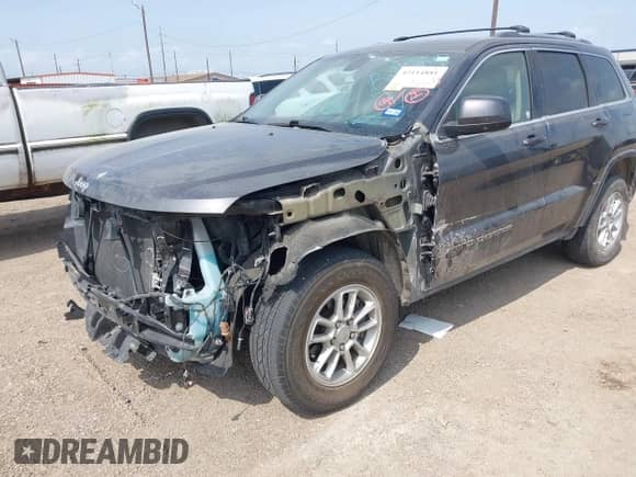 2020 Jeep Grand Cherokee Laredo E with VIN 1C4RJEAG2LC284912, listed as a IAAI auction lot 42114881 with 86,579 mi miles and . Bid and sale history available at DreamBid. Image 6.