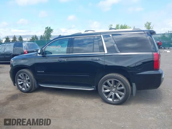 2018 Chevrolet Tahoe Premier with VIN 1GNSKCKC8JR104865, listed as a IAAI auction lot 42771057 with 123,387 mi miles and . Bid and sale history available at DreamBid. Image 14.