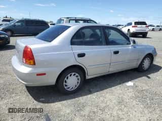 2005 Hyundai Accent GLS с VIN KMHCG45C65U576674, выставлен на аукционе Copart как лот 50726074 с пробегом 118 532 миль миль и На запчасти • Non repairable. История ставок и продаж доступна на DreamBid. Изображение 3.