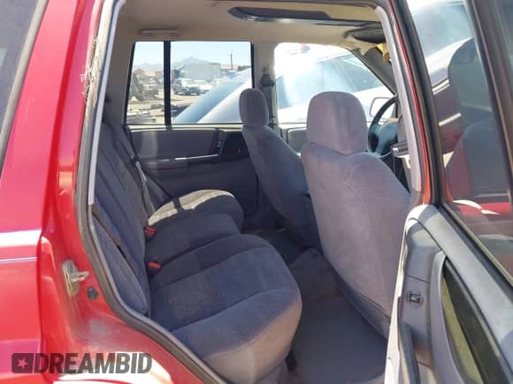 1996 Jeep Grand Cherokee Laredo z VIN 1J4GZ58Y5TC183677, wystawiony jako IAAI lot #42582989 z przebiegiem 187 453 mil mil oraz . Historia ofert i sprzedaży dostępna na DreamBid. Obrazek 8.