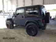 2002 Jeep Wrangler Sport z VIN 1J4FA49S22P715529, wystawiony jako Copart lot #89871905 z przebiegiem 133 220 mil mil oraz Szkoda całkowita • Salvage title. Historia ofert i sprzedaży dostępna na DreamBid. Obrazek 2.