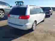 2009 Toyota Sienna XLE with VIN 5TDZK22C59S276897, listed as a IAAI auction lot 43165842 with 214,043 mi miles and . Bid and sale history available at DreamBid. Image 4.