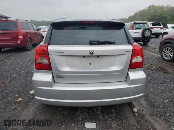 2007 Dodge Caliber SXT with VIN 1B3HB48B97D508286, listed as a Copart auction lot 73680884 with 131,318 mi miles and Salvage title. Bid and sale history available at DreamBid. Image 6.