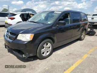 2012 Dodge Grand Caravan Crew with VIN 2C4RDGDG7CR299329, listed as a Copart auction lot 68716235 with 168,908 mi miles and Salvage title. Bid and sale history available at DreamBid. Image 1.