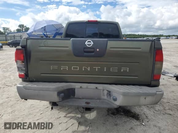 2003 Nissan Frontier XE z VIN 1N6ED26T23C452359, wystawiony jako Copart lot #70995355 z przebiegiem 168 490 mil mil oraz Szkoda całkowita • Salvage title. Historia ofert i sprzedaży dostępna na DreamBid. Obrazek 6.