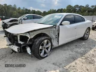 2016 Dodge Charger R/T with VIN 2C3CDXCT8GH354830, listed as a Copart auction lot 71774215 with 123,621 mi miles and Salvage title. Bid and sale history available at DreamBid. Image 1.