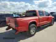2002 Dodge Dakota Sport z VIN 1B7HL38X52S716509, wystawiony jako Copart lot #47255785 z przebiegiem 167 450 mil mil oraz Nie do naprawy • Non repairable. Historia ofert i sprzedaży dostępna na DreamBid. Obrazek 3.