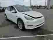 2023 Tesla Model Y Long Range with VIN 7SAYGAEE2PF590760, listed as a Copart auction lot 69752835 with 57,026 mi miles and Salvage title. Bid and sale history available at DreamBid. Image 15.