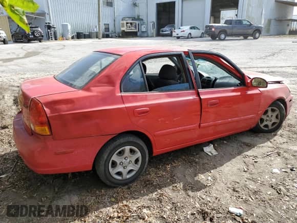 2005 Hyundai Accent GLS с VIN KMHCG45CX5U618473, выставлен на аукционе Copart как лот 76752994 с пробегом Не указан миль и Списание • Salvage title. История ставок и продаж доступна на DreamBid. Изображение 3.