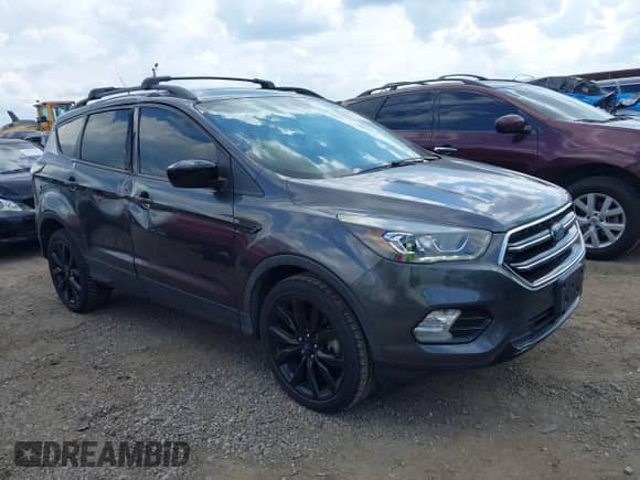 2018 Ford Escape SE z VIN 1FMCU9GD7JUC34463, wystawiony jako IAAI lot #43081579 z przebiegiem 85 940 mil mil oraz . Historia ofert i sprzedaży dostępna na DreamBid. Obrazek 1.