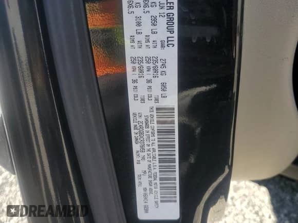 2012 Dodge Grand Caravan American Value z VIN 2C4RDGBGXCR378058, wystawiony jako Copart lot #89621325 z przebiegiem 220 716 mil mil oraz Czysty tytuł • Clean title. Historia ofert i sprzedaży dostępna na DreamBid. Obrazek 13.