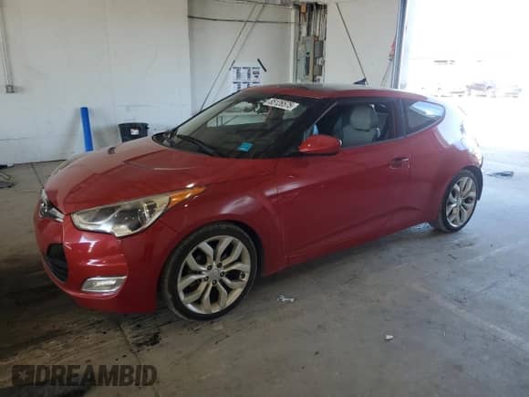 2013 Hyundai Veloster w/Black Int с VIN KMHTC6AD1DU087037, выставлен на аукционе Copart как лот 85126575 с пробегом 137 953 миль миль и Списание • Salvage title. История ставок и продаж доступна на DreamBid. Изображение 1.