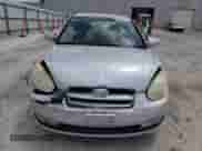 2007 Hyundai Accent SE z VIN KMHCN36C67U020057, wystawiony jako Copart lot #61012645 z przebiegiem 155 714 mil mil oraz Szkoda całkowita • Salvage title. Historia ofert i sprzedaży dostępna na DreamBid. Obrazek 5.
