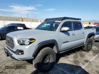 2021 Toyota Tacoma SR with VIN 3TYCZ5AN3MT024049, listed as a Copart auction lot 84284885 with 75,927 mi miles and Salvage title. Bid and sale history available at DreamBid. Image 1.