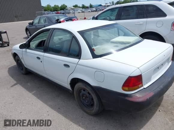 1996 Saturn SL z VIN 1G8ZH5287TZ196724, wystawiony jako IAAI lot #42394672 z przebiegiem 223 179 mil mil oraz . Historia ofert i sprzedaży dostępna na DreamBid. Obrazek 3.