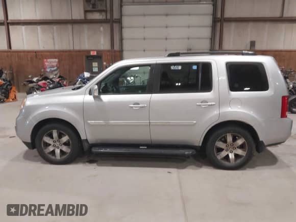 2012 Honda Pilot Touring with VIN 5FNYF4H90CB034523, listed as a IAAI auction lot 43540902 with 269,702 mi miles and . Bid and sale history available at DreamBid. Image 14.