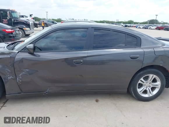 2019 Dodge Charger SXT with VIN 2C3CDXBG7KH707734, listed as a IAAI auction lot 42659110 with 68,600 mi miles and . Bid and sale history available at DreamBid. Image 14.