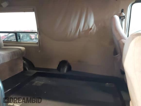 1999 Ford Econoline Cargo with VIN 1FDRE14W5XHA87026, listed as a IAAI auction lot 42573756 with 93,360 mi miles and . Bid and sale history available at DreamBid. Image 8.