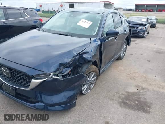 2024 Mazda CX-5 S Preferred z VIN JM3KFBCL2R0446390, wystawiony jako IAAI lot #42624381 z przebiegiem 21 293 mil mil oraz . Historia ofert i sprzedaży dostępna na DreamBid. Obrazek 6.