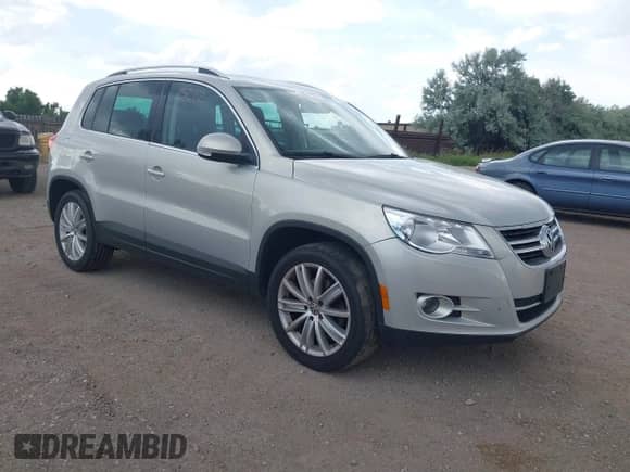 2011 Volkswagen Tiguan S with VIN WVGBV7AXXBW560022, listed as a IAAI auction lot 42693212 with 127,879 mi miles and . Bid and sale history available at DreamBid. Image 1.