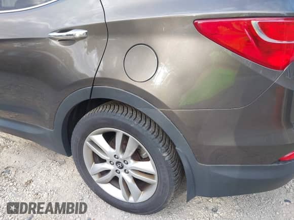 2014 Hyundai Santa Fe with VIN 5XYZUDLA5EG181900, listed as a IAAI auction lot 43133128 with 223,945 mi miles and . Bid and sale history available at DreamBid. Image 18.