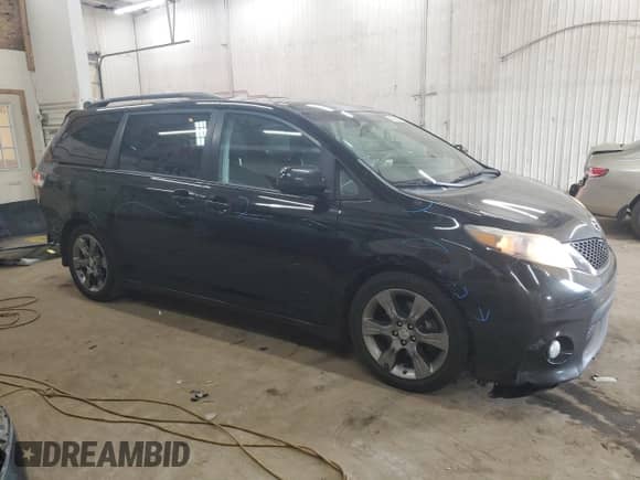2011 Toyota Sienna SE with VIN 5TDXK3DCXBS110665, listed as a Copart auction lot 84588025 with 317,691 mi miles and Salvage title. Bid and sale history available at DreamBid. Image 4.