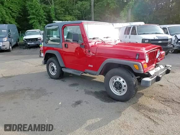 2000 Jeep Wrangler SE with VIN 1J4FA29P8YP711686, listed as a Copart auction lot 68999455 with 100,108 mi miles and Salvage title. Bid and sale history available at DreamBid. Image 14.