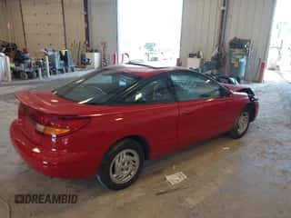 1997 Saturn 2dr Coupe с VIN 1G8ZH1277VZ110038, выставлен на аукционе IAAI как лот 42546514 с пробегом 83 164 миль миль и . История ставок и продаж доступна на DreamBid. Изображение 4.