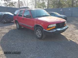 1999 Chevrolet Blazer LT z VIN 1GNDT13WXX2177269, wystawiony jako IAAI lot #42095422 z przebiegiem 210 049 mil mil oraz . Historia ofert i sprzedaży dostępna na DreamBid. Obrazek 1.