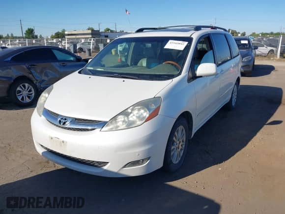 2009 Toyota Sienna XLE with VIN 5TDZK22C59S276897, listed as a IAAI auction lot 43165842 with 214,043 mi miles and . Bid and sale history available at DreamBid. Image 2.