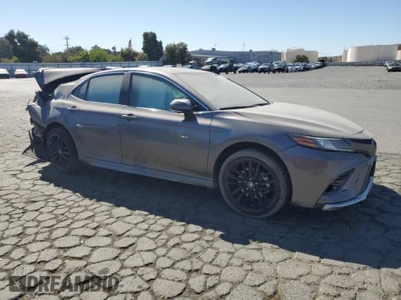2023 Toyota Camry Hybrid XSE с VIN 4T1K31AK6PU615026, выставлен на аукционе Copart как лот 83769475 с пробегом 141 199 миль миль и Списание • Salvage title. История ставок и продаж доступна на DreamBid. Изображение 4.