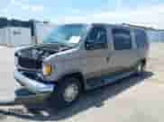 2002 Ford Econoline Cargo Recreational with VIN 1FDRE14L72HB80077, listed as a IAAI auction lot 42626721 with 218,830 mi miles and . Bid and sale history available at DreamBid. Image 2.