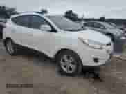 2012 Hyundai Tucson GLS with VIN KM8JUCAC5CU373403, listed as a Copart auction lot 69547285 with 141,239 mi miles and Salvage title. Bid and sale history available at DreamBid. Image 4.