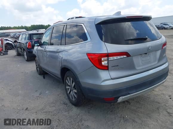 2020 Honda Pilot EX-L z VIN 5FNYF6H51LB067958, wystawiony jako IAAI lot #42799028 z przebiegiem 87 038 mil mil oraz . Historia ofert i sprzedaży dostępna na DreamBid. Obrazek 3.