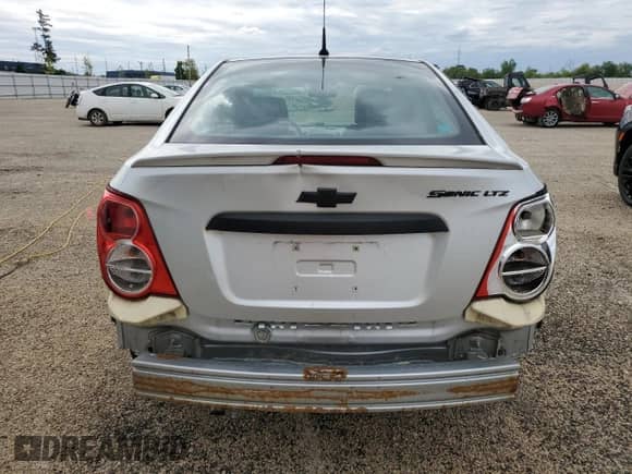 2013 Chevrolet Sonic LTZ с VIN 1G1JE5SH7D4152807, выставлен на аукционе Copart как лот 58600395 с пробегом 129 542 миль миль и Списание • Salvage title. История ставок и продаж доступна на DreamBid. Изображение 6.