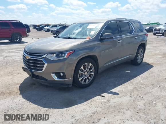2018 Chevrolet Traverse Premier with VIN 1GNERKKW0JJ115063, listed as a IAAI auction lot 43278445 with 126,658 mi miles and . Bid and sale history available at DreamBid. Image 2.
