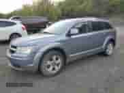 2010 Dodge Journey SXT with VIN 3D4PG5FV7AT117950, listed as a Copart auction lot 82028075 with 65,015 mi miles and Salvage title. Bid and sale history available at DreamBid. Image 1.