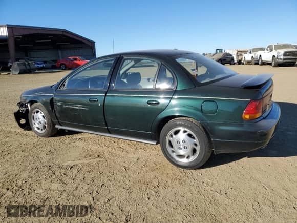 1996 Saturn SL with VIN 1G8ZK527XTZ335205, listed as a Copart auction lot 42230735 with 82,344 mi miles and Salvage title. Bid and sale history available at DreamBid. Image 2.