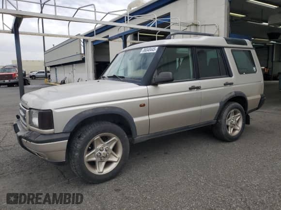 2000 Land Rover Discovery Cloth with VIN SALTY1541YA261319, listed as a Copart auction lot 86040445 with 153,917 mi miles and Clean title. Bid and sale history available at DreamBid. Image 1.