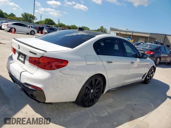2018 BMW 5 Series M550i xDrive with VIN WBAJB9C54JB034746, listed as a Copart auction lot 71218435 with 128,279 mi miles and Clean title. Bid and sale history available at DreamBid. Image 3.