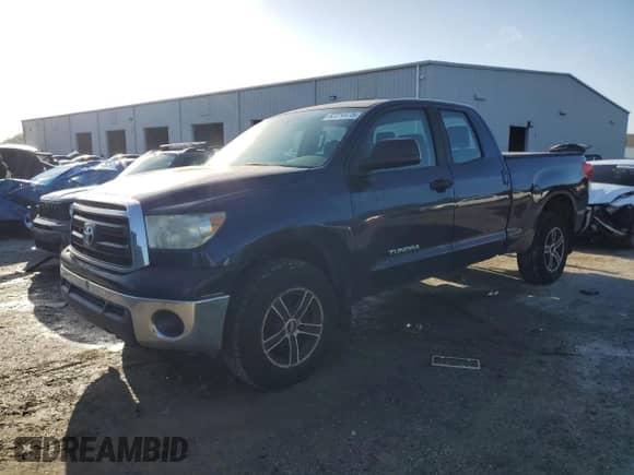 2012 Toyota Tundra с VIN 5TFRM5F1XCX040803, выставлен на аукционе Copart как лот 82314415 с пробегом 223 115 миль миль и Чистый • Clean title. История ставок и продаж доступна на DreamBid. Изображение 1.