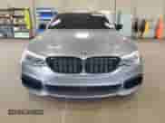 2018 BMW 5 Series M550i xDrive with VIN WBAJB9C51JB034817, listed as a Copart auction lot 69056245 with 132,405 mi miles and Salvage title. Bid and sale history available at DreamBid. Image 5.