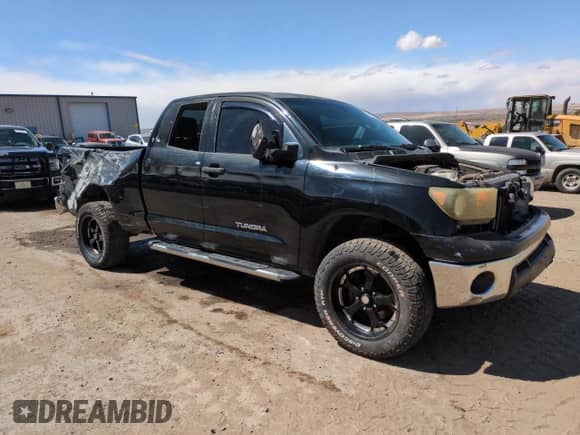 2012 Toyota Tundra z VIN 5TFRU5F10CX028076, wystawiony jako Copart lot #50353735 z przebiegiem 171 321 mil mil oraz Szkoda całkowita • Salvage title. Historia ofert i sprzedaży dostępna na DreamBid. Obrazek 4.