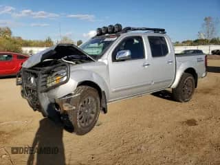 2011 Nissan Frontier Pro-4X z VIN 1N6AD0EV2BC443228, wystawiony jako Copart lot #85303555 z przebiegiem 142 368 mil mil oraz Szkoda całkowita • Salvage title. Historia ofert i sprzedaży dostępna na DreamBid. Obrazek 1.