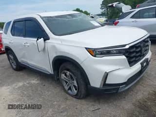 2024 Honda Pilot EX-L z VIN 5FNYG2H59RB000703, wystawiony jako IAAI lot #42030106 z przebiegiem 18 432 mil mil oraz . Historia ofert i sprzedaży dostępna na DreamBid. Obrazek 1.