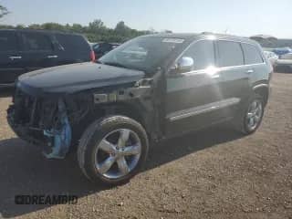 2013 Jeep Grand Cherokee Limited with VIN 1C4RJFBG1DC606896, listed as a Copart auction lot 85170145 with 143,154 mi miles and Salvage title. Bid and sale history available at DreamBid. Image 1.